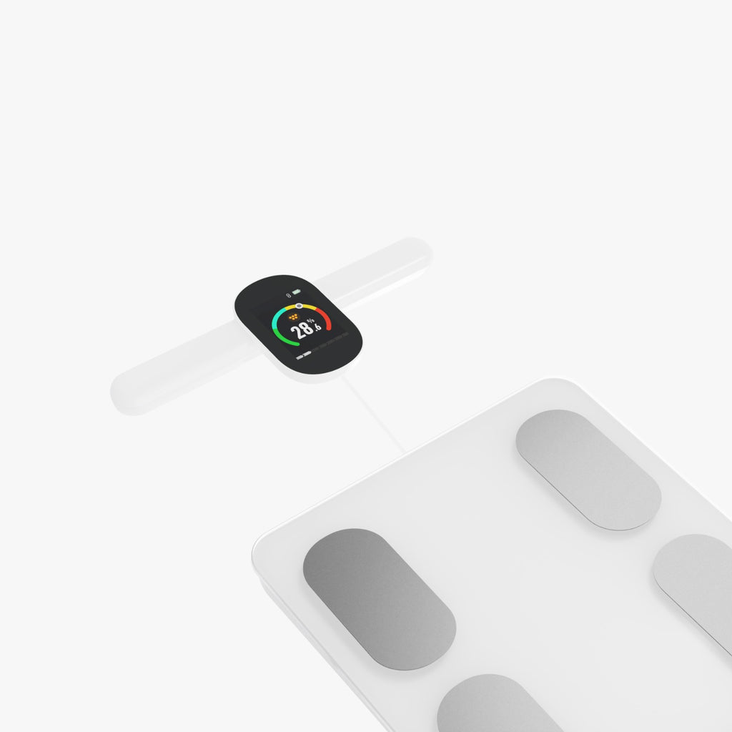 Smartwatch and digital scale on a white background
